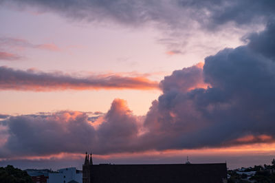 Scenic view of dramatic sky over sea during sunset
