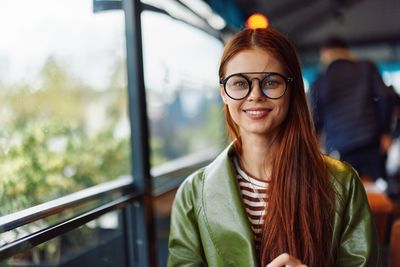 Portrait of young woman wearing sunglasses