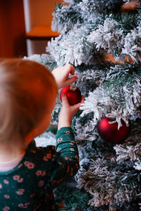High angle view of girl holding christmas tree