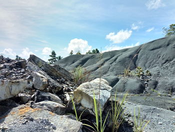 Rock formations on landscape against sky