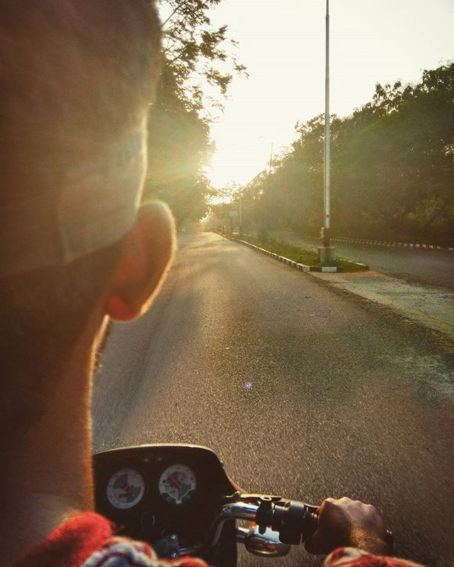 transportation, part of, land vehicle, person, mode of transport, personal perspective, lifestyles, cropped, bicycle, road, leisure activity, men, riding, unrecognizable person, car, street, tree