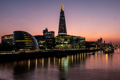 Illuminated city at waterfront