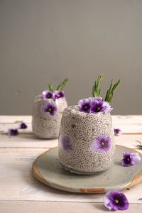 Close-up of purple flowers on table