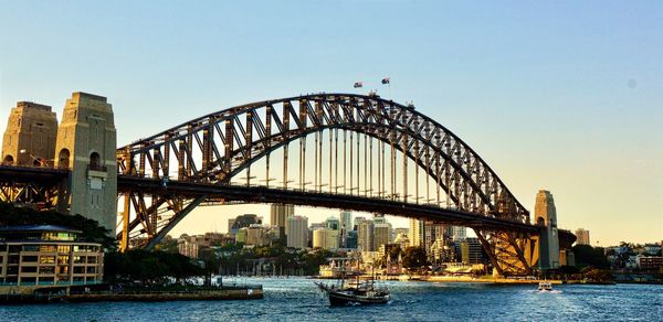 View of bridge over river in city