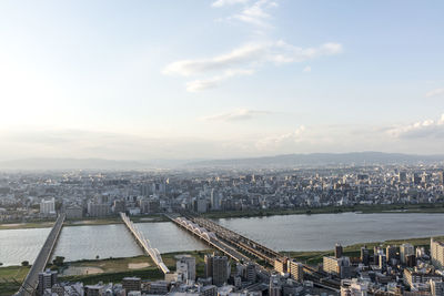 High angle view of river along cityscape