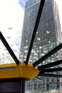 Low angle view of office building against sky