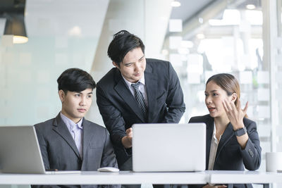 Two people working in office