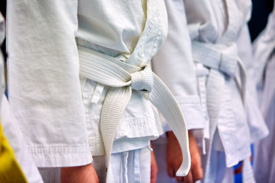 Close-up of clothes hanging in row