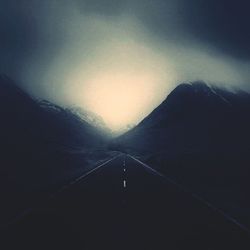 Scenic view of mountains in foggy weather