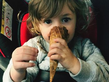 High angle view of toddler eating ice cream