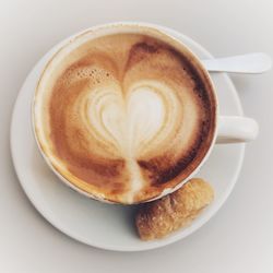 Close-up of cappuccino served on table