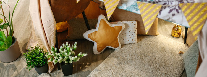 Top view of homemade tent made with chairs and bed sheets in the living room