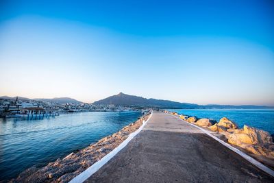 Scenic view of sea against clear blue sky