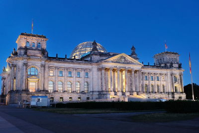 Facade of historical building against blue sky