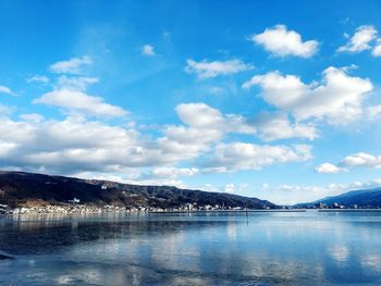 Scenic view of lake against blue sky