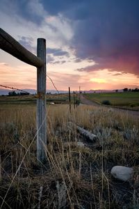 Scenic view of field against sky during sunset