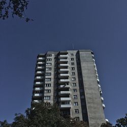 Low angle view of building against blue sky