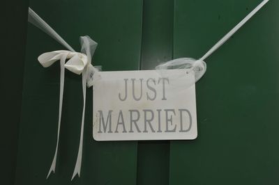 Close-up of information sign on wall