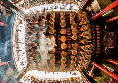 Low angle view of spiral incenses in pagoda