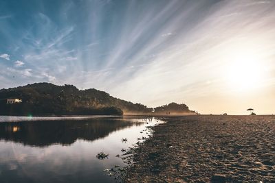 Scenic view of lake against sky during sunset