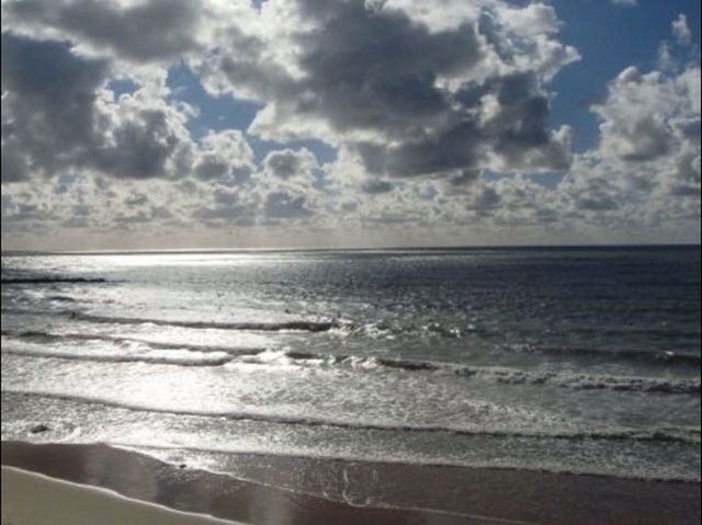 sea, horizon over water, water, sky, beach, scenics, tranquil scene, beauty in nature, cloud - sky, tranquility, shore, cloudy, nature, idyllic, cloud, sand, wave, seascape, coastline, outdoors