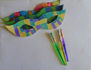 High angle view of multi colored paper on table