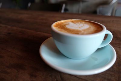 Close-up of cappuccino on table