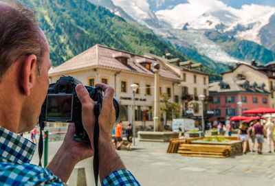 Man photographing at camera