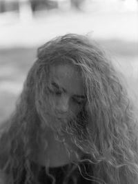 Close-up portrait of young woman looking away