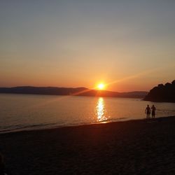 Scenic view of sea at sunset