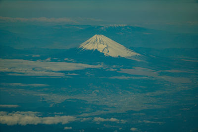 Aerial view of volcanic landscape against sky