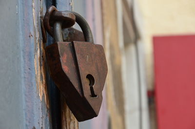 Close-up of padlock on metal door