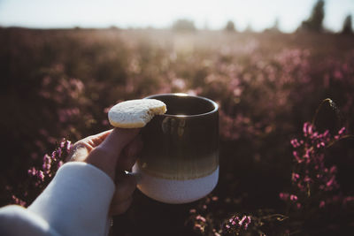 Close-up of hand holding coffee