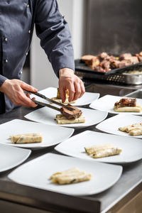 Midsection of man having food on table