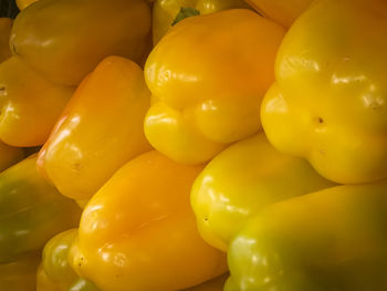 Close-up of yellow bell peppers for sale in market