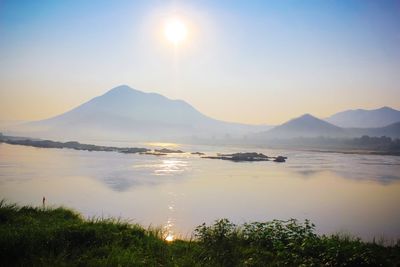 Scenic view of lake against sky during sunset