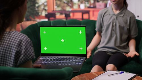 Midsection of woman using laptop