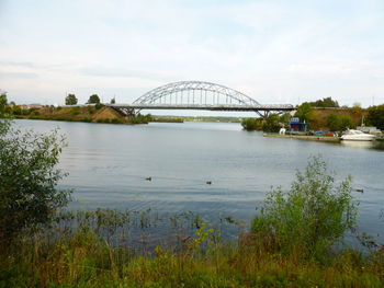 Bridge over river against sky