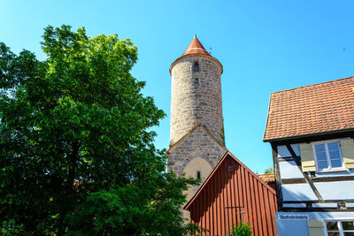 Low angle view of buildings against blue sky