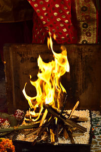 Close-up of bonfire on wooden log