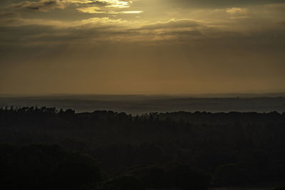 Scenic view of silhouette landscape against sky during sunset