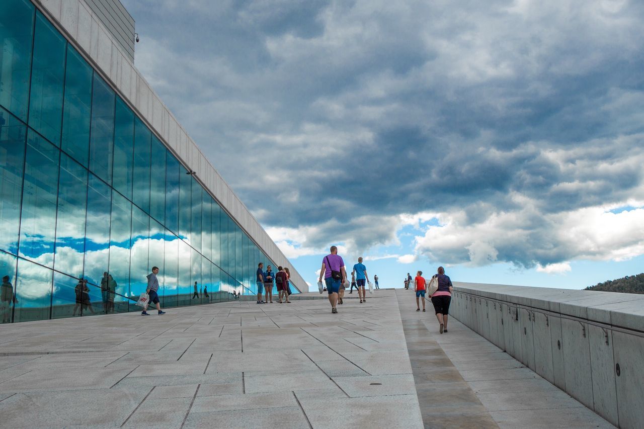 sky, cloud - sky, cloudy, built structure, men, architecture, lifestyles, leisure activity, person, cloud, large group of people, walking, weather, building exterior, famous place, travel, day, tourism, travel destinations