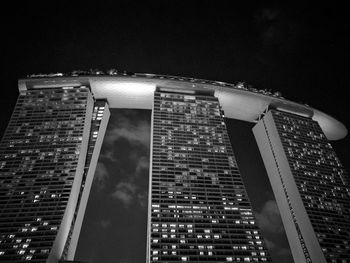 Low angle view of skyscrapers lit up at night