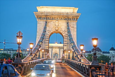 View of bridge against sky in city