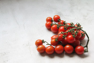 Close-up of cherry tomatoes against white background