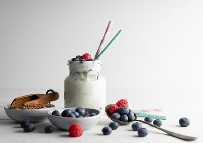 Close-up of breakfast on table against white background