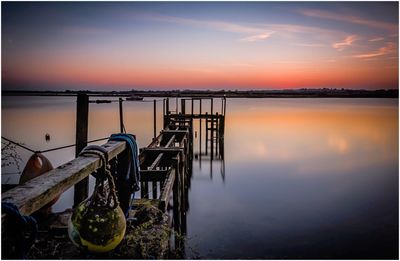 Scenic view of sea against sky at sunset