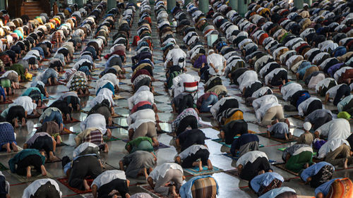 High angle view of men praying