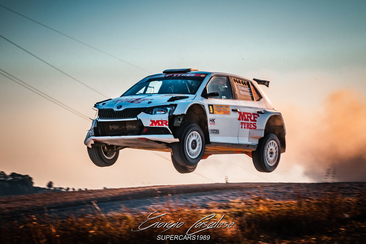 VINTAGE CAR AGAINST SKY