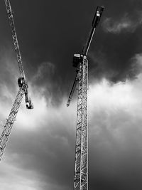 Low angle view of crane against sky